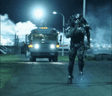 a predator is running towards a school bus at night