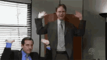 the office steve carell rainn wilson cheering hands up
