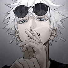 a man wearing sunglasses smoking a cigarette