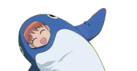 a boy is wearing a blue penguin costume with his arms outstretched
