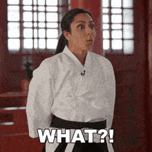 a woman in a martial arts uniform says what ?