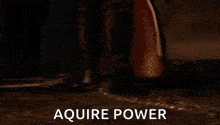 a man is holding a sword in his hand and the words `` acquire power '' are on the screen .