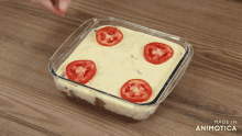 a casserole dish with tomatoes and mashed potatoes is made in animatica