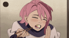 a girl with pink hair holds chopsticks in her mouth