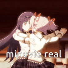 two anime girls are hugging each other with the words minevie real in the corner