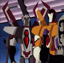 a group of transformers are standing next to each other and one of them has the word transformers on it