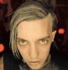 a close up of a man 's face with gray hair