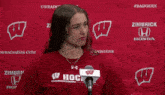 a woman wearing a red shirt that says hog