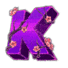 a purple letter k surrounded by pink flowers