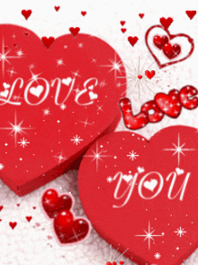 a couple of red hearts with the words love you on them