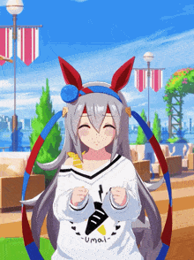 a girl wearing a sweatshirt that says umai