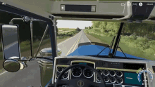 a video game shows the dashboard of a kenworth semi truck