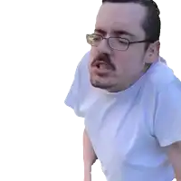 a man wearing glasses and a white shirt is making a face