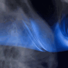 a dark blue background with a few white spots