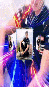 a man in a black shirt is sitting on a rock surrounded by other pictures .