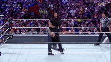 Roman Reigns The Undertaker GIF - Roman Reigns The Undertaker Tombstone GIFs
