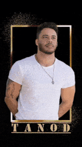 a man in a white shirt with the name tanod on the bottom right