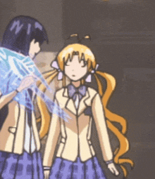 a girl with a ponytail is standing next to a boy with the letter w on his forehead