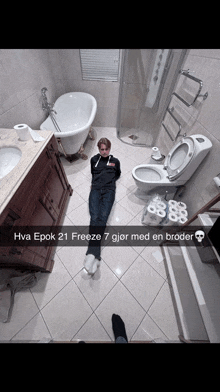 a person is laying on the floor in a bathroom with a caption that says hva epok 21 freeze 7 jor med en broder