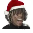 a person wearing headphones and a santa hat is smiling .