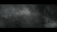 the word dumiss is on a dark background