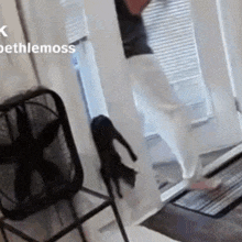 a person standing in front of a door with bethlemoss written on the bottom left