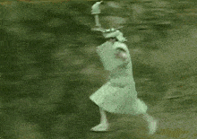 a person is splashing in a river with a green object .