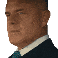 a close up of a man 's face with a blue suit and tie