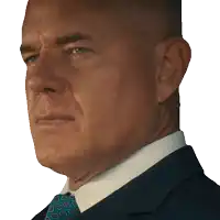 a close up of a man 's face with a blue suit and tie