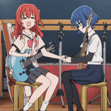 a girl with red hair is sitting next to a girl with blue hair