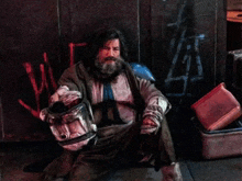 a man sitting on the ground with a sign that says cap ap on it