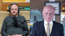 a man wearing headphones is sitting in a chair next to another man in a suit and tie .