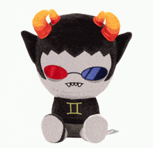 a stuffed toy with horns and a shirt that says ii on it
