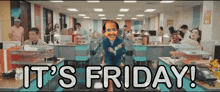 a man dancing in an office with the words it 's friday behind him