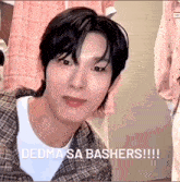 a close up of a person 's face with the words " dedma sa bashers " written on the bottom