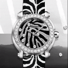 a chopard watch with a black and white zebra print strap