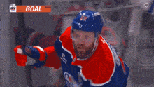 a hockey player with the number 29 on his jersey is celebrating a goal