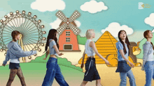 a group of women are walking in front of a ferris wheel and pyramid