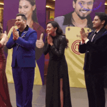 a group of people applauding in front of a banner that says one happy insan