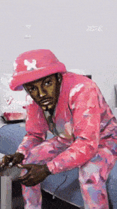 a painting of a man in a pink suit and hat with the year 2018