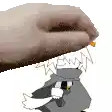 a close up of a hand holding a cartoon character 's head .