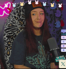 a woman wearing a beanie and a t-shirt that says ' 10 139 ' on it