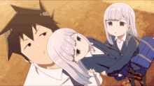a man and two girls are standing next to each other with one girl laying on the man 's lap