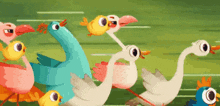 a bunch of birds are running in a line