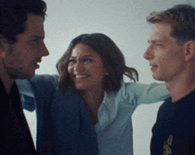 a man and a woman are hugging each other and smiling
