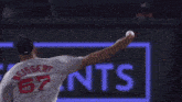 a baseball game is being played in front of a lexus advertisement
