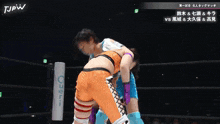 two women are wrestling in a ring with tjpw written on the bottom of the screen