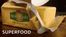 a block of kerrygold pure irish butter being opened
