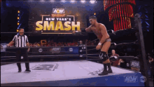 a wrestler in a ring with a sign that says smash