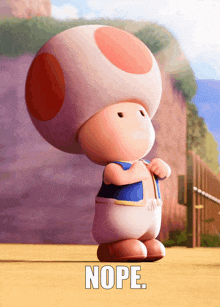 a toad in a blue shirt is standing on a sandy surface with the words nope written below him
